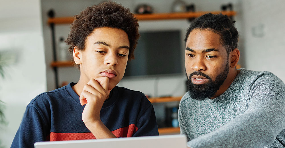 student and parent using computer